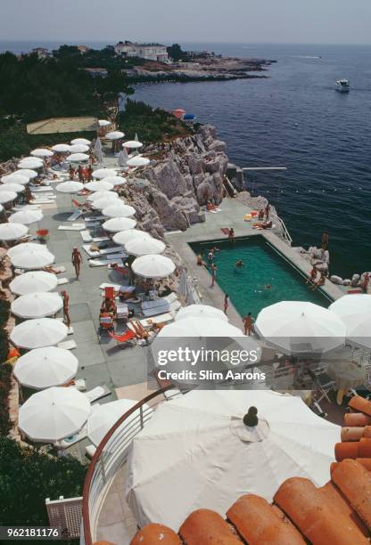 Guests round the swimming pool at the Hotel du Cap Eden-Roc, Antibes, France, August 1969.