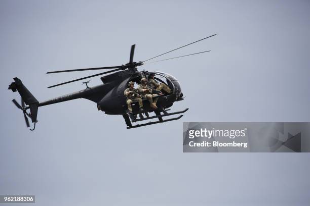 An MH-6 Little Bird helicopter, piloted by members of the U.S. Army's 160th Special Operations Aviation Regiment , flies overhead during an...