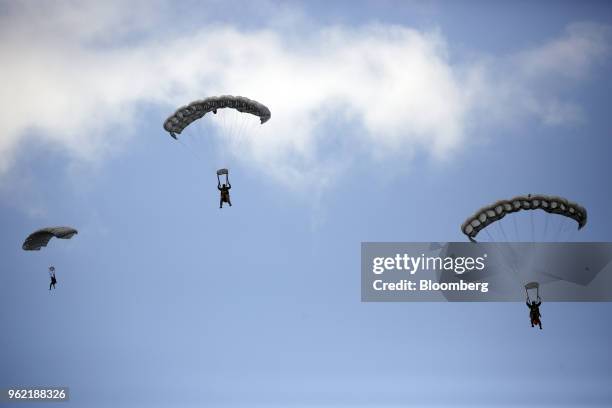 Special operators conduct a free-fall parachute jump into the bay during an International Special Operations Forces capacities exercise rehearsal...