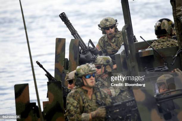 Navy Special Warfare Combatant-Craft Crewmen ride aboard a Special Operations Craft Riverine boat during an International Special Operations Forces...