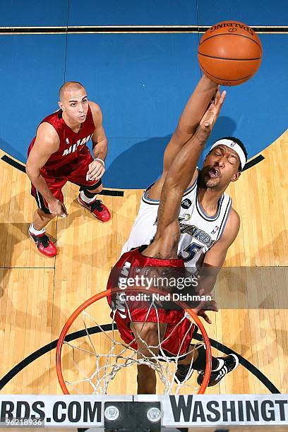 Dominic McGuire of the Washington Wizards goes to the basket against Mario Chalmers of the Miami Heat during the game on January 22, 2010 at the...