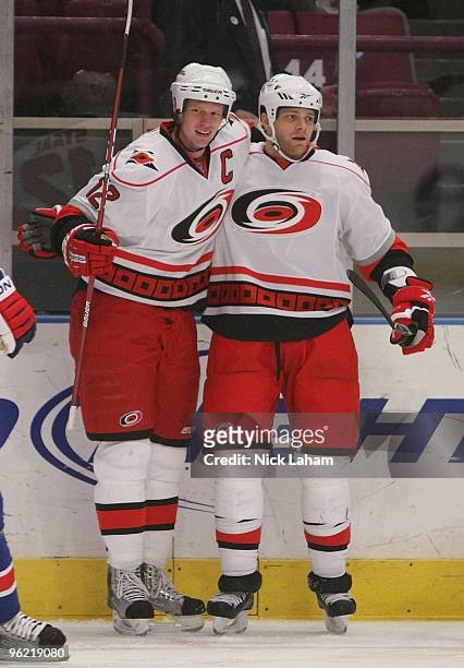 Eric Staal of the Carolina Hurricanes celebrates his goal with teammate Tim Gleason against the New York Rangers at Madison Square Garden on January...