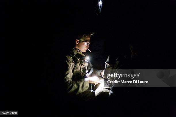 Army soldiers from B Company, 2nd Battalion,12th Infantry Regiment, 4th Brigade,4th Infantry Division Baker Company get ready for an operation in the...