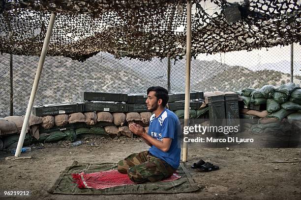 Army soldier from B Company, 2nd Battalion,12th Infantry Regiment, 4th Brigade,4th Infantry Division Baker Company stands on guard at on of the...