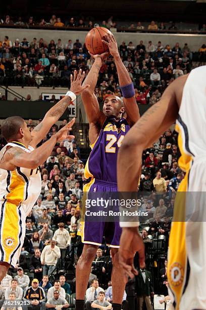 Kobe Bryant of the Los Angeles Lakers shoots over Earl Watson of the Indiana Pacers at Conseco Fieldhouse on January 27, 2010 in Indianapolis,...