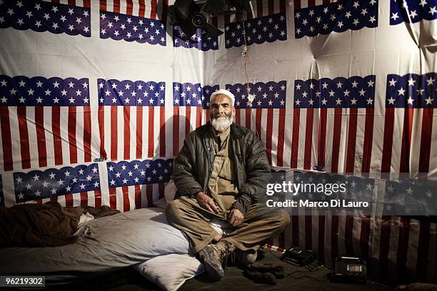 An Afghan worker nicknamed "trash man" by the US Army soldiers from B Company, 2nd Battalion,12th Infantry Regiment, 4th Brigade,4th Infantry...