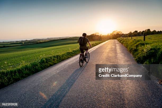 teenager riding his bike - zealand denmark stock pictures, royalty-free photos & images