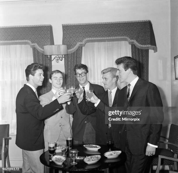 Cliff Richard and The Shadows, left to right, Cliff Richard, Tony Meehan, Hank B Marvin, Jet Harris and Bruce Welsh. They are drinking a toast of...