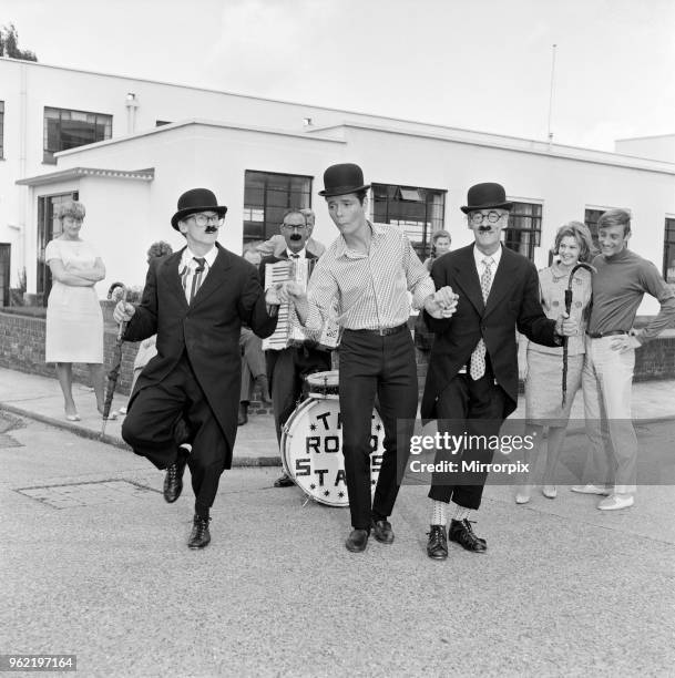 Recognise the bowler-hatted 'busker'? It's Cliff Richard, doing a soft-shoe shuffle with London's Road Stars buskers. Cliff had invited them to...