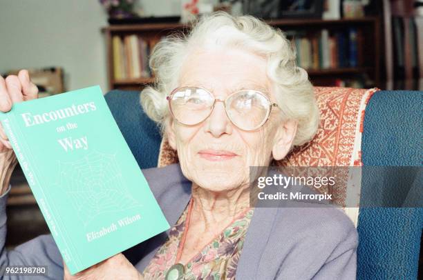 Elizabeth Wilson, Author with a copy of her book, Encounters on the Way, Circa 1998.