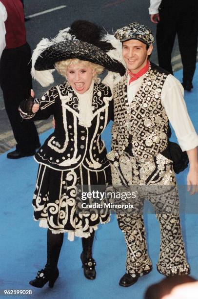 Barbara Windsor with boyfriend Scott Harvey, dressed as a Pearly Queen and King, arriving at Elton John's 50th birthday party at Hammersmith Palais,...