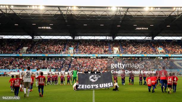 The teams enter the pitch prior to the Third League Playoff first leg match between KFC Uerdingen and Waldhof Mannheim at Schauinsland-Reisen-Arena...