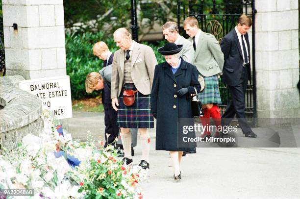 Royal Family, Balmoral Estate, Scotland, 5th September 1997. After attending a private service at Crathie Church, Royal family stop to look at floral...