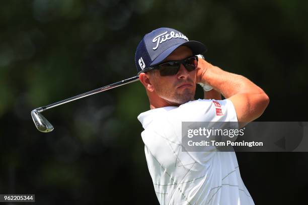 Adam Scott of Australia plays his shot from the ninth tee during round one of the Fort Worth Invitational at Colonial Country Club on May 24, 2018 in...