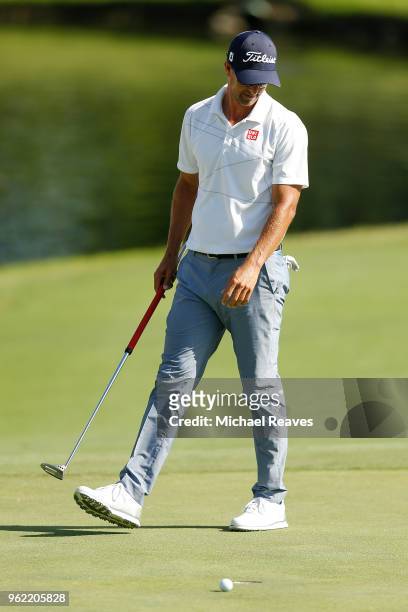 Adam Scott of Australia reacts after missing a putt on the 16th green during round one of the Fort Worth Invitational at Colonial Country Club on May...
