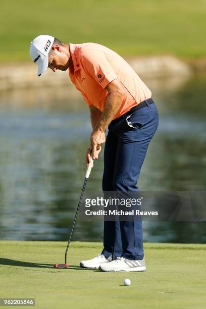 Justin Rose of England putts on the 16th green during round one of the Fort Worth Invitational at Colonial Country Club on May 24, 2018 in Fort...