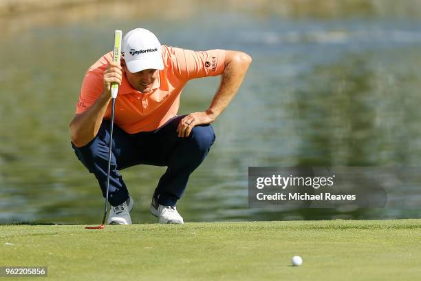 Justin Rose of England looks over a putt on the 16th green during round one of the Fort Worth Invitational at Colonial Country Club on May 24, 2018...