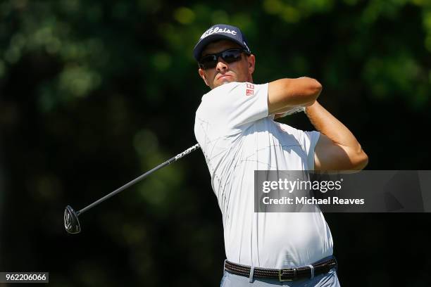 Adam Scott of Australia plays his shot from the 12th tee during round one of the Fort Worth Invitational at Colonial Country Club on May 24, 2018 in...