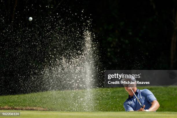 Zach Johnson plays a shot from a bunker on the 11th hole during round one of the Fort Worth Invitational at Colonial Country Club on May 24, 2018 in...