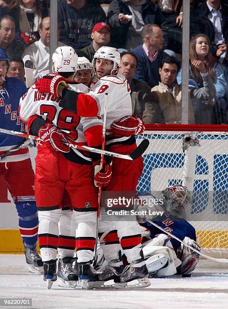 Tom Kostopoulos, Matt Cullen and Sergei Samsonov of the Carolina Hurricanes celebrate their goal against the New York Rangers in the second period on...