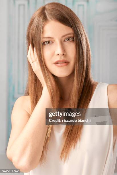 natural look girl touching her long straight hair - ストレートヘア ストックフォトと画像