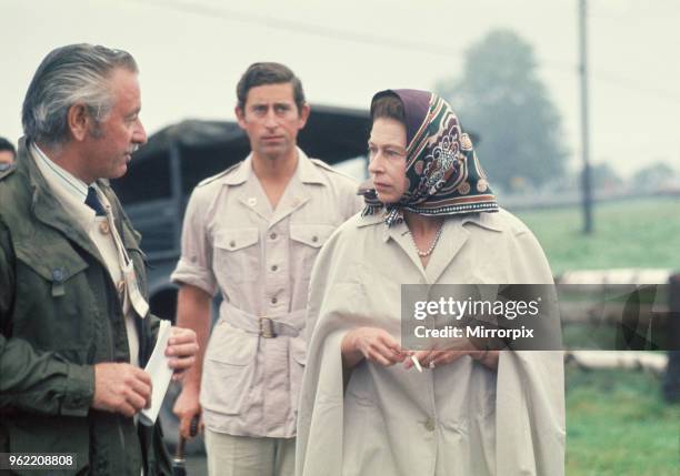 Queen Elizabeth II , attends the 1976 Olympic Games in Canada. In this picture the Queen is about to watch Princess Anne compete in the cross...