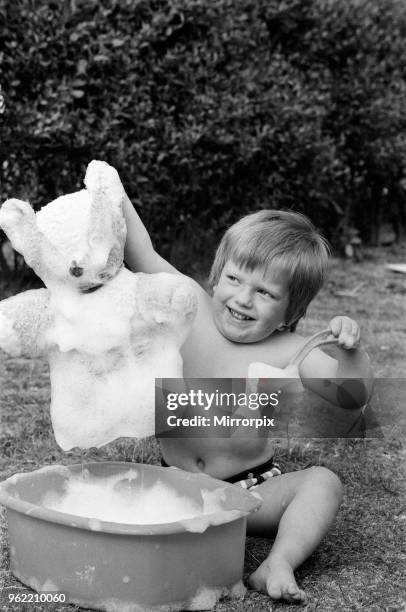 Pictured, Simon Bostic bathing his teddy bear in his garden. Simon, who will be four years old tomorrow , was found to have an extremely rare blood...