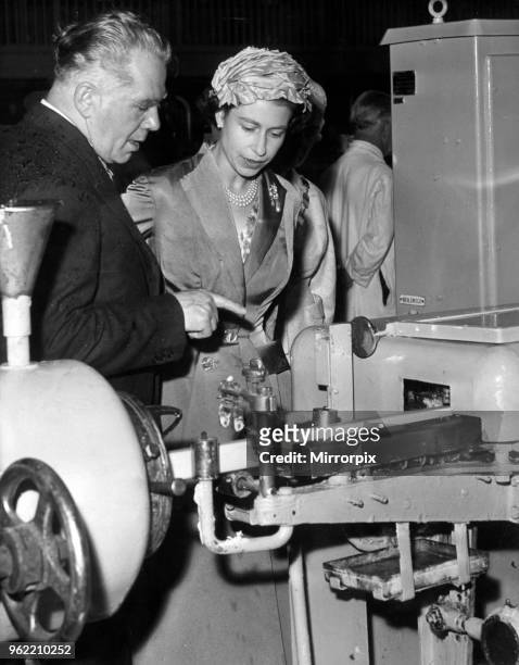 Queen Elizabeth II visiting Wirral, Merseyside. Mr F S Walker carries the Royal visitors soap production education a step further. July 1957.