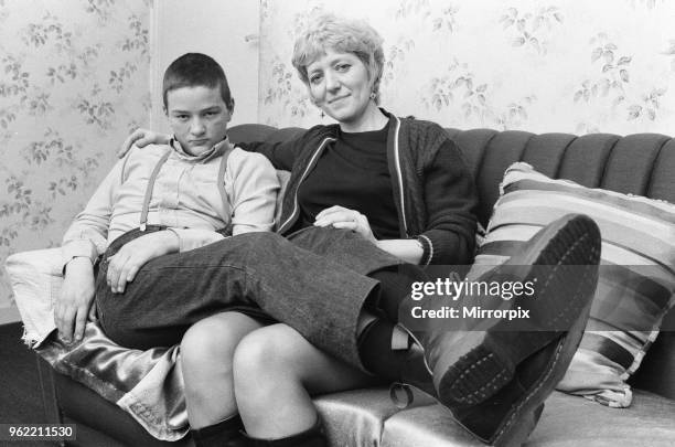 Fifteen year old skinhead Chris Harward poses at home with his mother Joan at their flat in Streatham, South London, 10th April 1970.