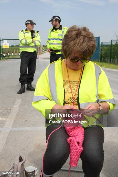 An Anti-Frack Protester known as a "Nana" knits at the gates of Fracking company "Cuadrilla's" Frack site during a quiet day of continuing protests....