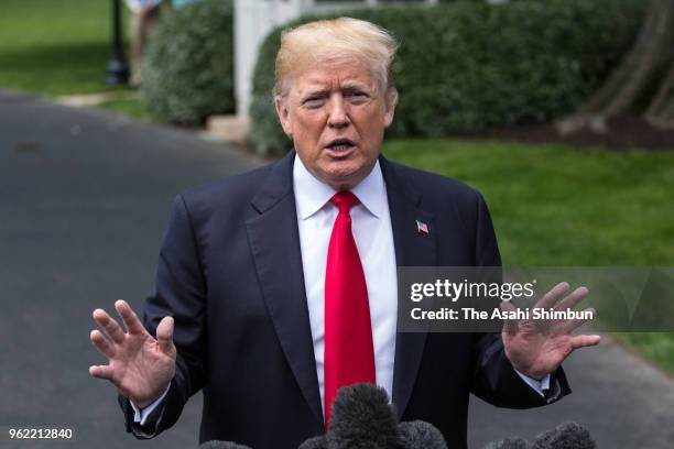 President Donald Trump talks to journalists before departing the White House May 23, 2018 in Washington, DC. Trump is traveling to New York where he...