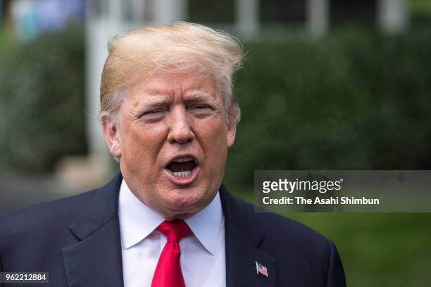 President Donald Trump talks to journalists before departing the White House on May 23, 2018 in Washington, DC. Trump is traveling to New York where...