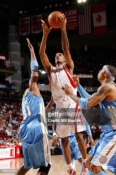 Trevor Ariza of the Houston Rockets shoots the ball over Chris Andersen of the Denver Nuggets on January 27, 2010 at the Toyota Center in Houston,...