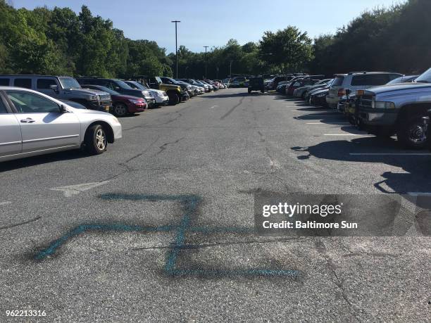 Swastika was found spray-painted on the parking lot at Glenelg High School in Howard County Thursday, May 24, 2018. Custodial staff cleaned the...