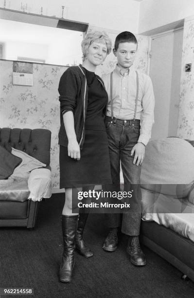 Fifteen year old skinhead Chris Harward poses at home with his mother Joan at their flat in Streatham, South London, 10th April 1970.