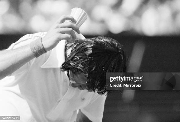 Ilie Nastase, Romanian Tennis Player, feels the heat at Wimbledon Tennis Championships, temperatures of 104 degrees were registered on the Centre...