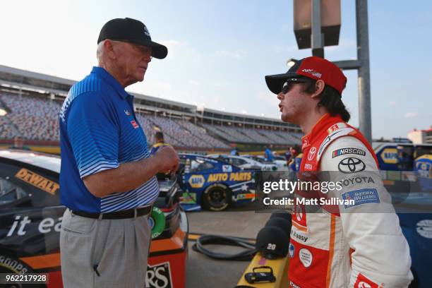 Team owner, Joe Gibbs, speaks with Erik Jones, driver of the Circle K Toyota, during qualifying for the Monster Energy NASCAR Cup Series Coca-Cola...