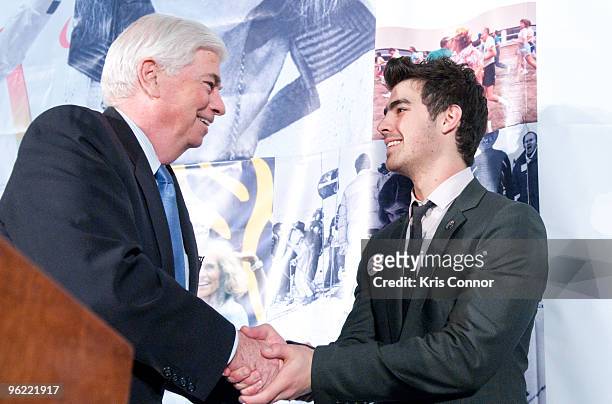 Sen. Chris Dodd and singer Joe Jonas shake hands during the Eunice Kennedy Shriver Act support reception at the Hart Building on January 27, 2010 in...