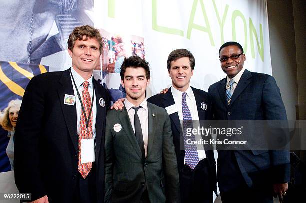 Anthony Shriver, Joe Jonas, Timothy Shriver and Carl Lewis pose for a photo during the Eunice Kennedy Shriver Act support reception at the Hart...