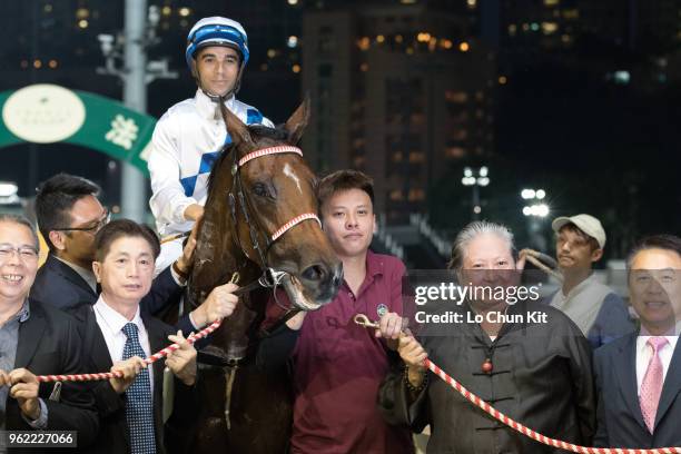 Jockey Joao Moreira and owner Sammo Hung Kam Po celebrate after Jolly Amber winning the Race 1 France Galop Owners Department Handicap at Happy...