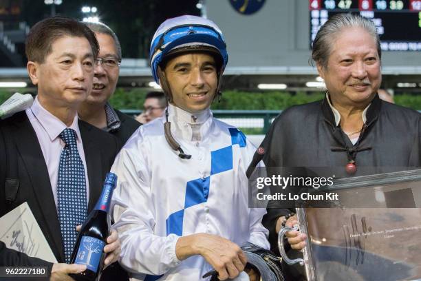 Jockey Joao Moreira and owner Sammo Hung Kam Po celebrate after Jolly Amber winning the Race 1 France Galop Owners Department Handicap at Happy...