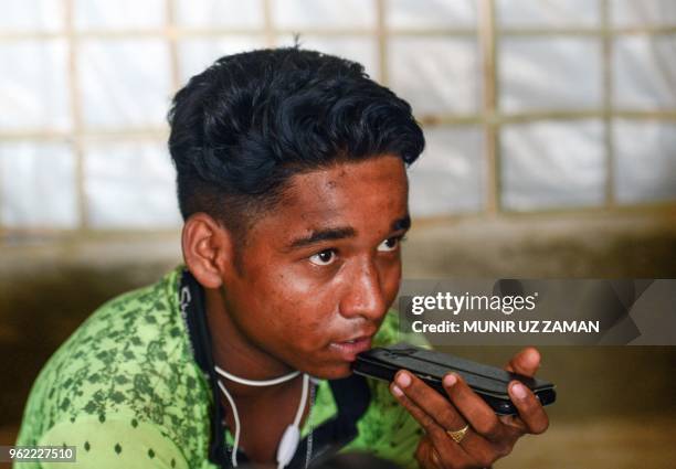 In this photograph taken on April 7 Rohingya Muslim refugee Robi Alam looks on during an interview with AFP at his house in Kutupalong refugee camp...