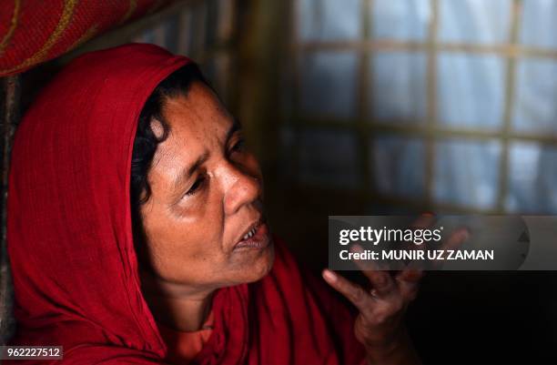 In this photograph taken on April 7 Rohingya Muslim refugee Khadija Begum, the mother of 16-year-old Rohingya youth Robi Alam, speaks during an...
