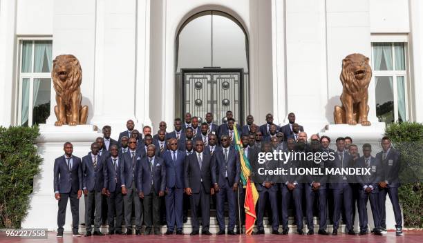 The Senegalese National Football poses for a photo with President Macky Sall at the Palace of the Republic during a ceremony in Dakar on May 23 ahead...