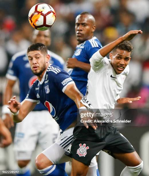 Matias de los Santos of Milionarios and Pedrinho of Corinthians of Brazil in action during the match for the Copa CONMEBOL Libertadores 2018 at Arena...