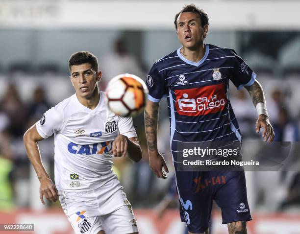 Vitor Bueno of Santos battles for the ball with Dulanto of Real Garcilaso during the match between Santos and Real Garcilaso as a part of Copa...