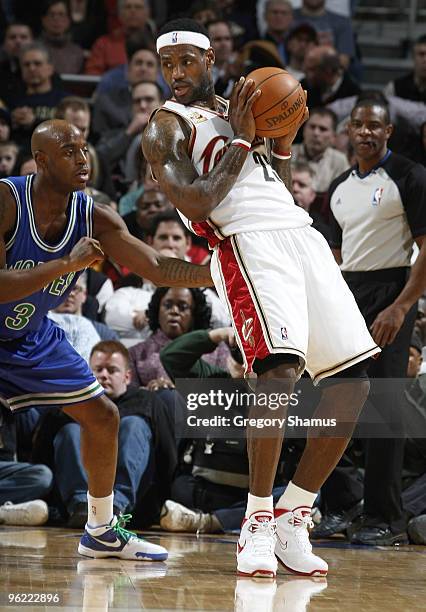 LeBron James Cleveland Cavaliers looks to make a move on Damien Wilkins of the Minnesota Timberwolves on January 27, 2010 at the Quicken Loans Arena...