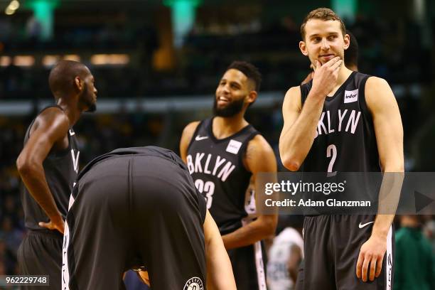 Nik Stauskas of the Brooklyn Nets smiles during a huddle in a game against the Boston Celtics at TD Garden on April 11, 2018 in Boston,...