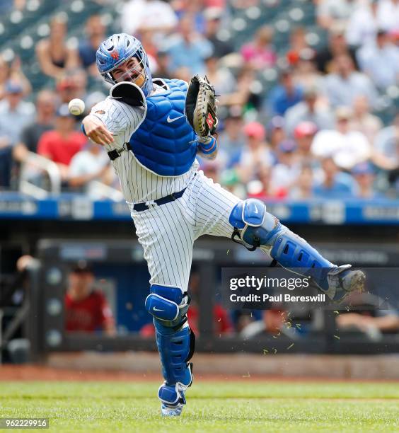 Tomas Nido of the New York Mets throws out Chris Owings at first base to end the 5th inning of an MLB baseball game against the Arizona Diamondbacks...