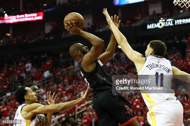 Chris Paul of the Houston Rockets shoots against Klay Thompson of the Golden State Warriors in the first half of Game Five of the Western Conference...